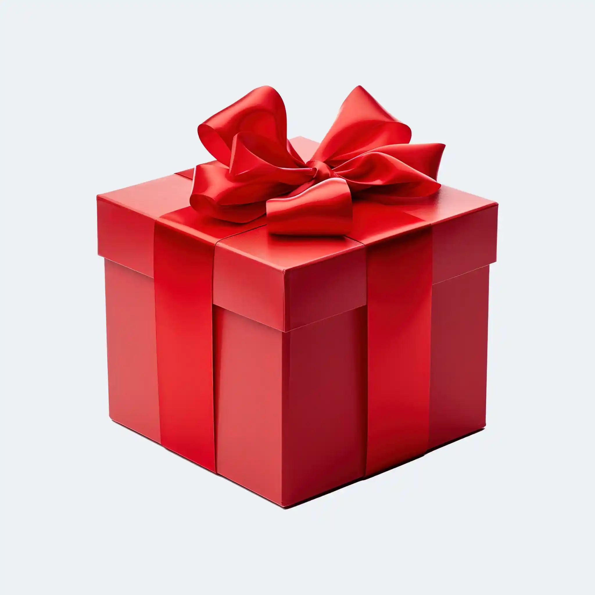 Red gift box with a large red bow on a light gray background