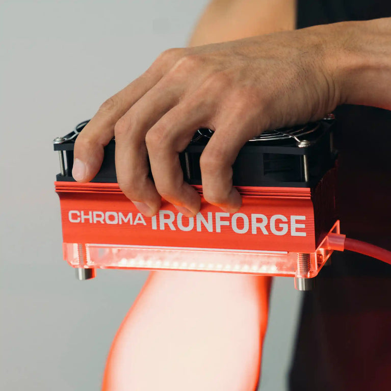 Chroma Ironforge Light Therapy Device being used on arm to show targeted recovery method.