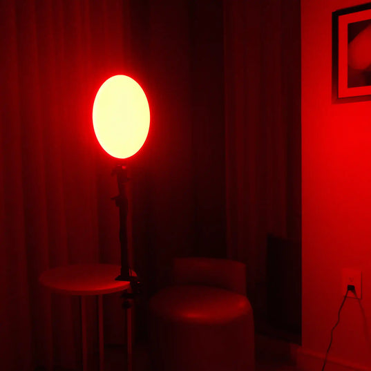 Chroma Red Portal in a dimly lit room projecting red light around the room
