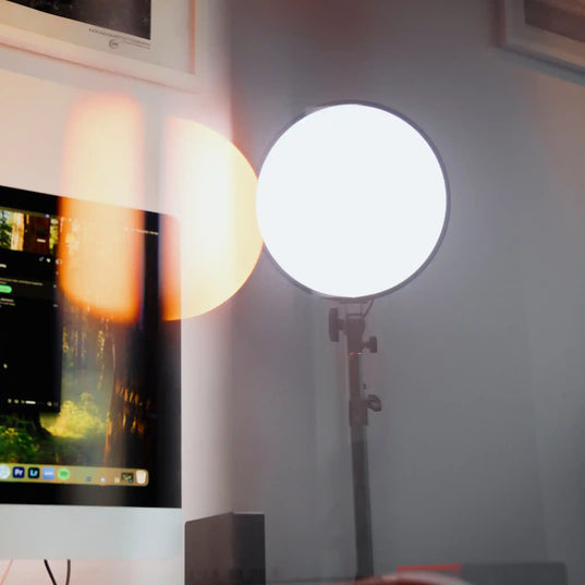 Chroma Sky Portal light device on a stand in front of a computer screen
