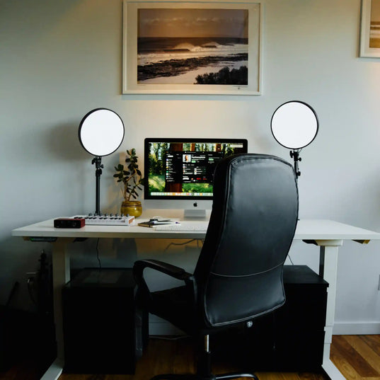 Home office setup with a desk, computer, and two Chroma Sky Portal light devices.
