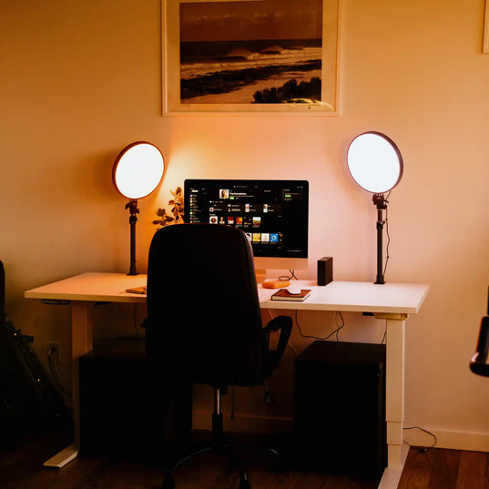 Home office setup with a desk, computer monitor, and two Chroma Sky Portal light devices.