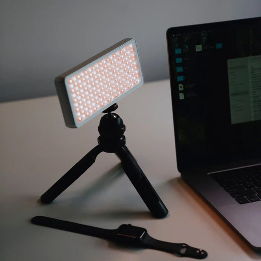 Chroma Sky Portal Mini on a tripod next to a laptop on a desk